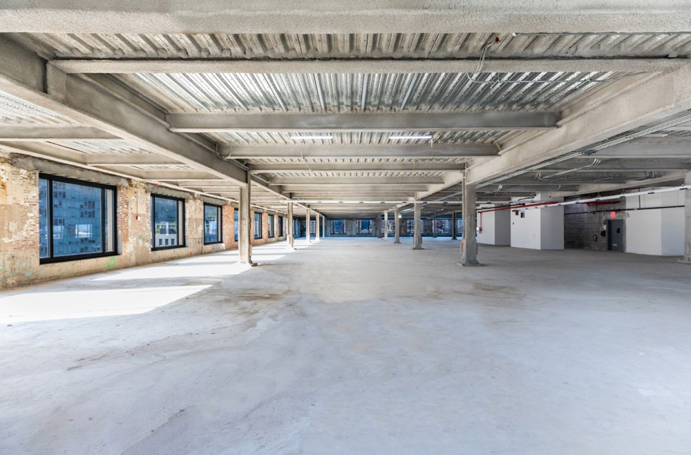 Empty open-concept workspace ready for leasing on 8th floor