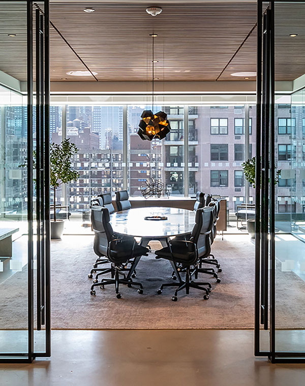 View from doorway into 10-person glass-walled conference room with city views